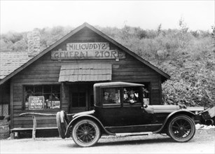 1916 Cadillac V8 car, parked outside a general store, USA, (c1916?). Artist: Unknown