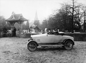 1922 11.9 hp Calcott outside a church, (c1922?). Artist: Unknown