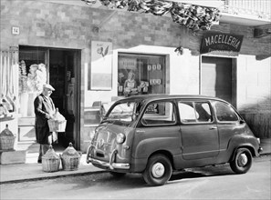Fiat 600 Multipla outside a shop, (c1955-c1965?). Artist: Unknown