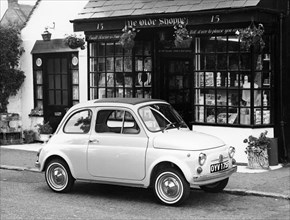 Fiat 500 parked outside a quaint shop, 1969. Artist: Unknown