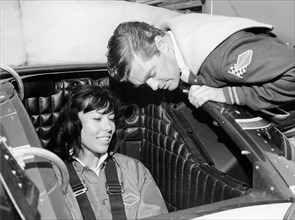 Craig Breedlove explaining the controls of 'Spirit of America Sonic I' to his wife, Lee, c1965. Artist: Unknown