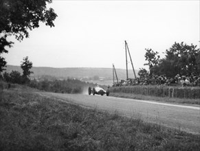 Rudolf Caracciola in his Mercedes, French Grand Prix, Rheims, 1938. Artist: Unknown