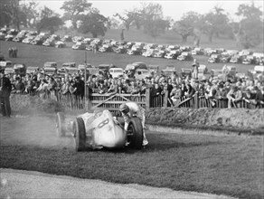 Dick Seaman with his Mercedes, Donington Grand Prix, 1938. Artist: Unknown