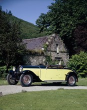 A 1934 Bugatti Type 46 outside a cottage. Artist: Unknown