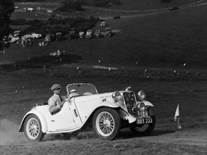 A Singer Nine Le Mans climbing a hill, 1935. Artist: Unknown
