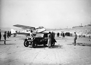 Riley Kestrel and a Dragon aircraft on a beach, 1934. Artist: Unknown