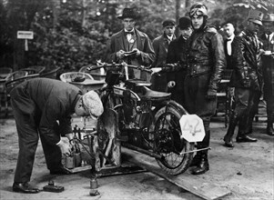Karl Burlage having his Norton bike weighed for a TT competition. Artist: Unknown