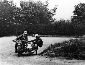 G Tucker racing a Norton bike, 1924. Artist: Unknown