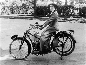 A woman on a Douglas motorbike, (c1913?). Artist: Unknown