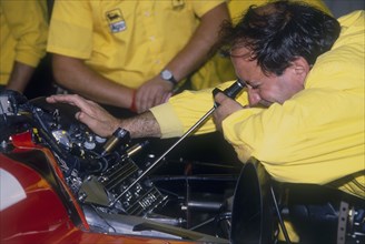 Mechanic at work in the Ferrari pits, 1988. Artist: Unknown