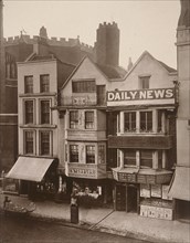 Figures standing near a shop front on Macclesfield Street, Soho, London, 1883. Artist: Henry Dixon