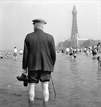 An elderly man paddling in the sea, Blackpool, c1946-c1955