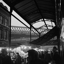 Street market in Electric Avenue, Brixton, London, 1962-1964