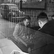 Men playing chess in a cafe, Hampstead, London, 1962-1964