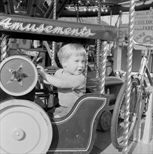 Child on a fairground ride, Hampstead, London, 1962-1964