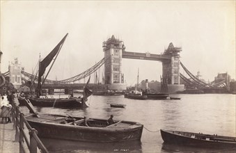 View of Tower Bridge under construction with river traffic in the foreground, London, c1893. Artist: Unknown