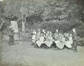 Arithmetic lesson in the garden, Birley House Open Air School, London, 1908. Artist: Unknown.