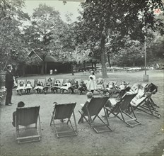Reading lesson outside, Bostall Woods Open Air School, London, 1907. Artist: Unknown.