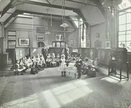 Recitation of The Sick Dolly, Flint Street School, Southwark, London, 1908. Artist: Unknown.