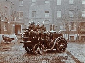 Firemen aboard a motor steamer, London Fire Brigade Headquarters, London, 1909. Artist: Unknown.