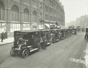 Hackney carriages and drivers at a taxi rank, Bishopsgate, London, 1912. Artist: Unknown.