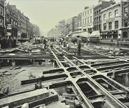 Men laying tramlines at a junction, Whitechapel High Street, London, 1929. Artist: Unknown.