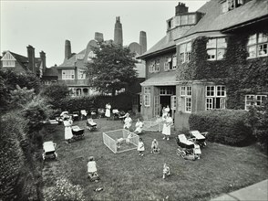 Children and carers in a garden, Hampstead, London, 1960. Artist: Unknown.
