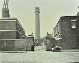 Shot Tower, gates with sphinxes, and milk cart, Belvedere Road, Lambeth, London, 1930. Artist: Unknown.