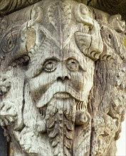 Carved head on the 17th century gatehouse corner post, Stokesay Castle, Shropshire