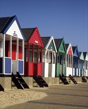 A row of eight colourful beach huts, Southwold, Suffolk