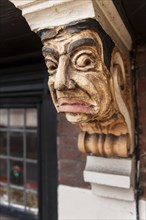 Painted corbel bracket on the Station public house, The Broadway, Stoneleigh, Ewell, Surrey, 2014