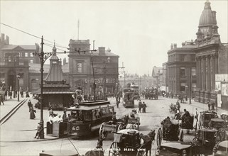 Horse-drawn taxis and electric trams on Fitzalan Square, Sheffield, Yorkshire, c1900 Artist