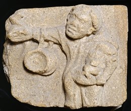 Carved stone depicting a monk carrying items, Muchelney Abbey, Somerset, c2010