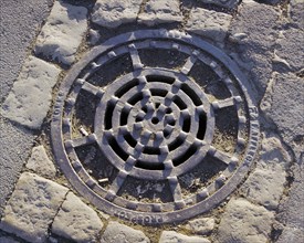 Iron drain cover made by Affleck, Prospect Works, Swindon, Wiltshire, 2006