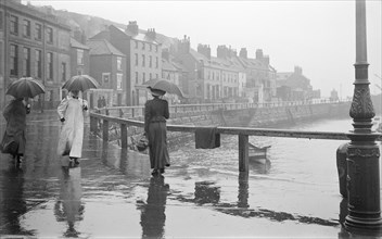 A rainy day on Pier Road, Whitby, North Yorkshire, 1896-1920