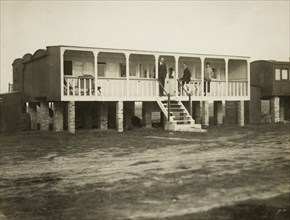 Railway carriage converted into a holiday home, possibly at Shoreham-by-Sea, West Sussex, 1920s