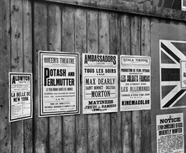Playbills on a hoarding, London, World War I, 1914