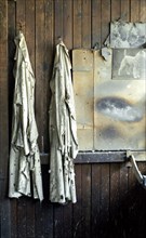 Overalls hanging up in JW Evans silversmiths factory, Birmingham, West Midlands, c1980-c2017