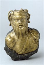 Roman steelyard weight in the form of a bearded satyr, found at Richborough Castle, Kent