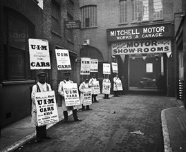 Sandwich board men advertising outside Mitchell Motors, 114 Wardour Street, London, 1910