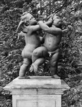 Cherubs - the Quarrel', statue in the gardens of Melbourne Hall, Derbyshire, 1954