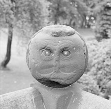 Carved Victorian stone head on a garden wall, Speke Hall, Liverpool, Merseyside, c1945-c1980