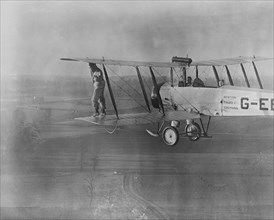 Wing walking without a harness on an Avro 504 biplane, 1932