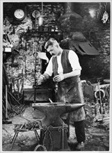 Mr Jefferies at work in the forge, Southrop, Cotswolds, Gloucestershire, 1938