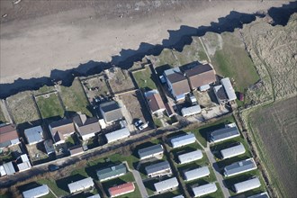 Bungalows at risk from coastal erosion, Green Lane, near Skipsea, East Riding of Yorkshire, 2014