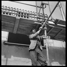 Builder working on the Penhill Estate, Swindon, Wiltshire, 1955