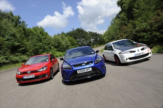 VW Golf GTi Renault Megane Sport R26R and Ford Focus RS 2009. Artist: Simon Clay.