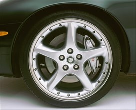 2002 Jaguar XKR alloy wheel. Artist: Unknown.
