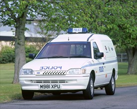 1995 Ford Escort Ecostar electric police van. Artist: Unknown.