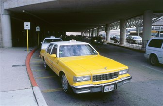 Yellow taxi cab at airport. Artist: Unknown.